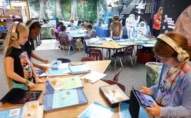 Many arts and crafts tables in a classroom