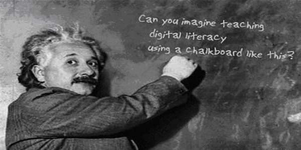 Einstein writing on chalk board quote