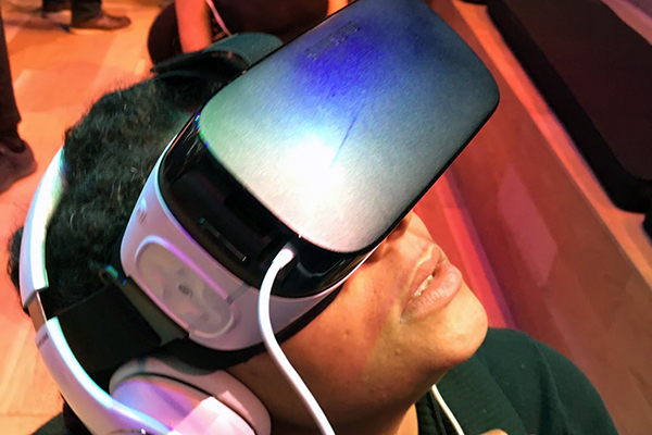 Boy wearing virtual reality headset and earphones