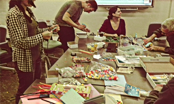 People making crafts at table