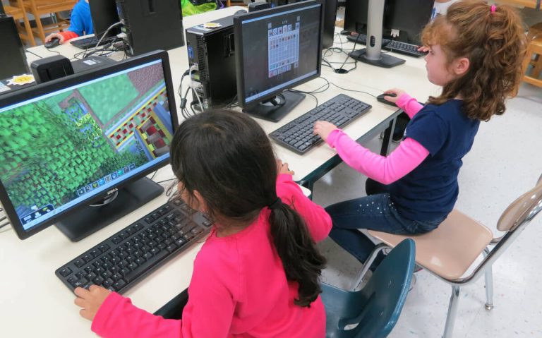 young children playing games on computer