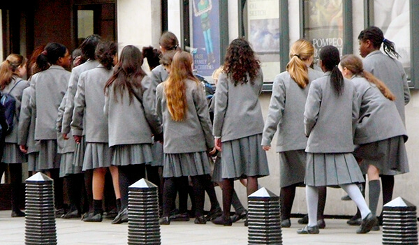 Group of London-based students in school uniform