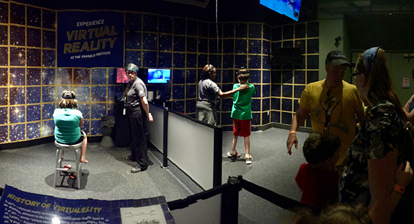 people using VR exhibit in museum