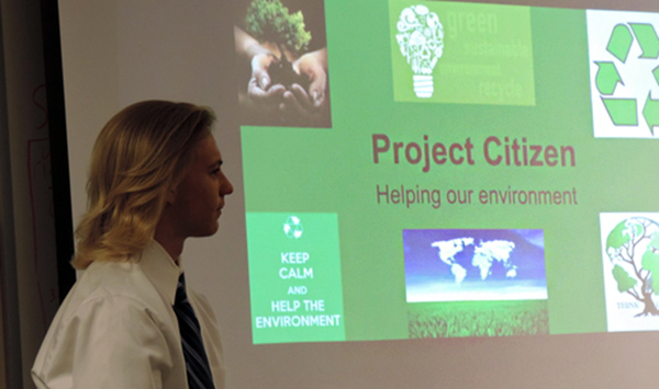 man giving presentation of project citizen helping our environment