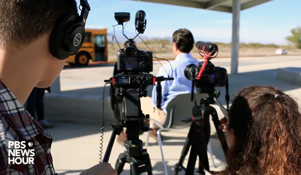 students videotaping an interview