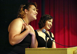 2 Women speaking at Podium