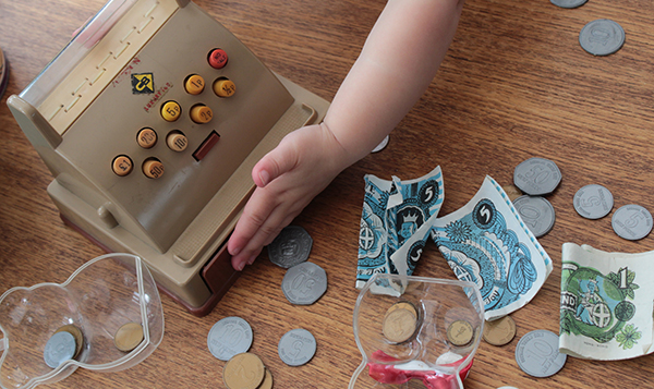 child hand with play money