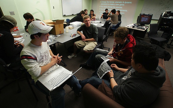 group of teen boys sitting together having classroom collaboration