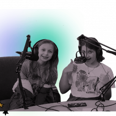Two children, in black and white, sit in front of microphones. A pastel purple and blue and white background.