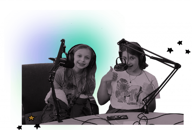 Two children, in black and white, sit in front of microphones. A pastel purple and blue and white background.